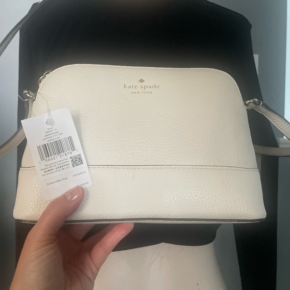 Kate Spade pebbled leather flat base with rounded silhouette